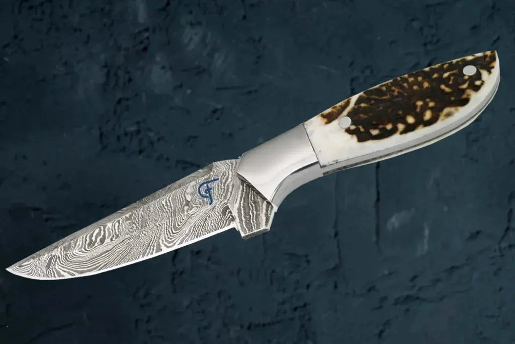 Faneema Cutlery best outdoor knife with antler handle featuring a patterned blade and ergonomic grip