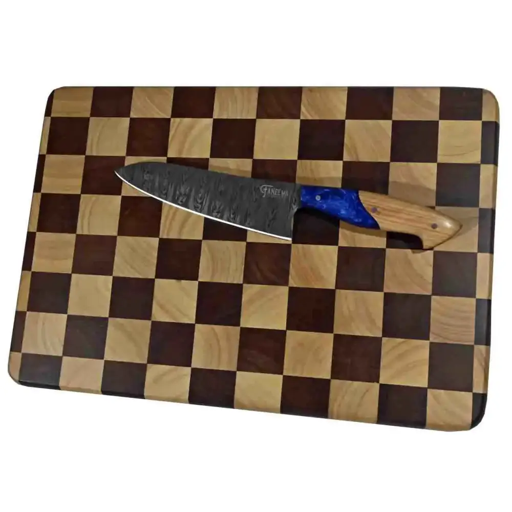 Sleek chef knife with blue handle on lena checker cutting board