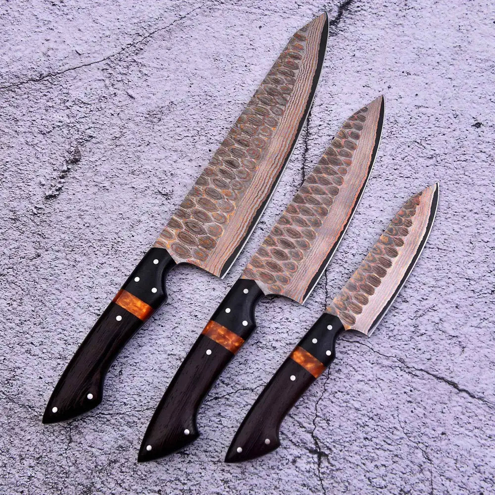 Copper damascus knife set with wavy blades and copper inlays