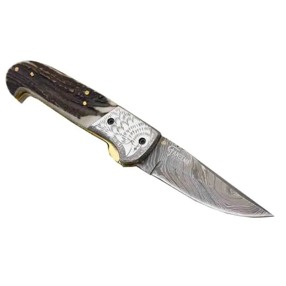 Damascus pocket knife with engraved silver guard and stag handle