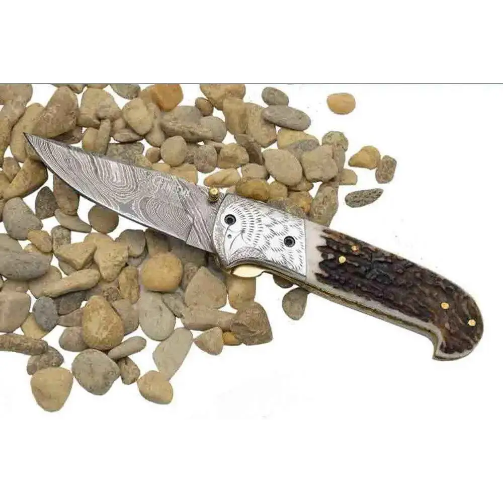 Damascus pocket knife with engraved silver and stag handle