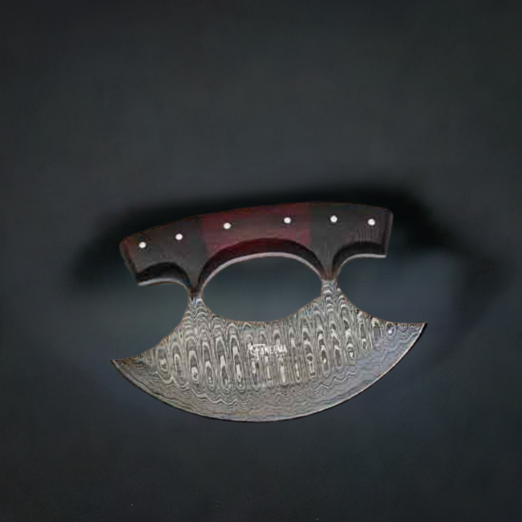 An ALASKAN ULU Damascus Knife by Faneema Cutlery, showcasing an ornate pattern on its Damascus steel and a dark handle adorned with three rivets, is displayed against a dark background. The intricate texture and razor-sharp design of the blade are prominently featured.