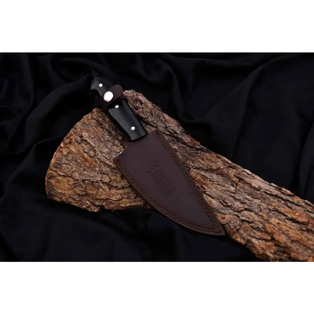 Janeema Couter hand-forged durable 440C hunting knife on tree bark