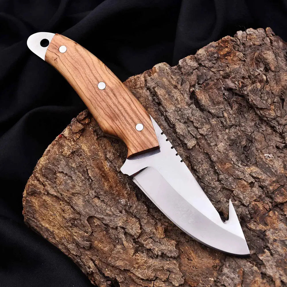 Sleek silver gut hook knife with wood handle and metal bolster