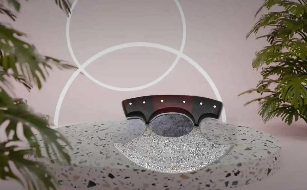 A sleek, curved axe with a black and red handle featuring silver rivets and a damascus steel blade.